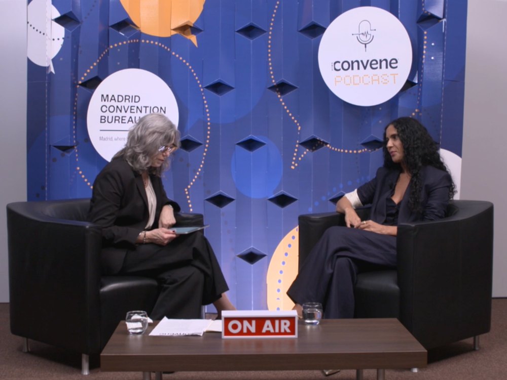 Aline in conversation during a live interview
