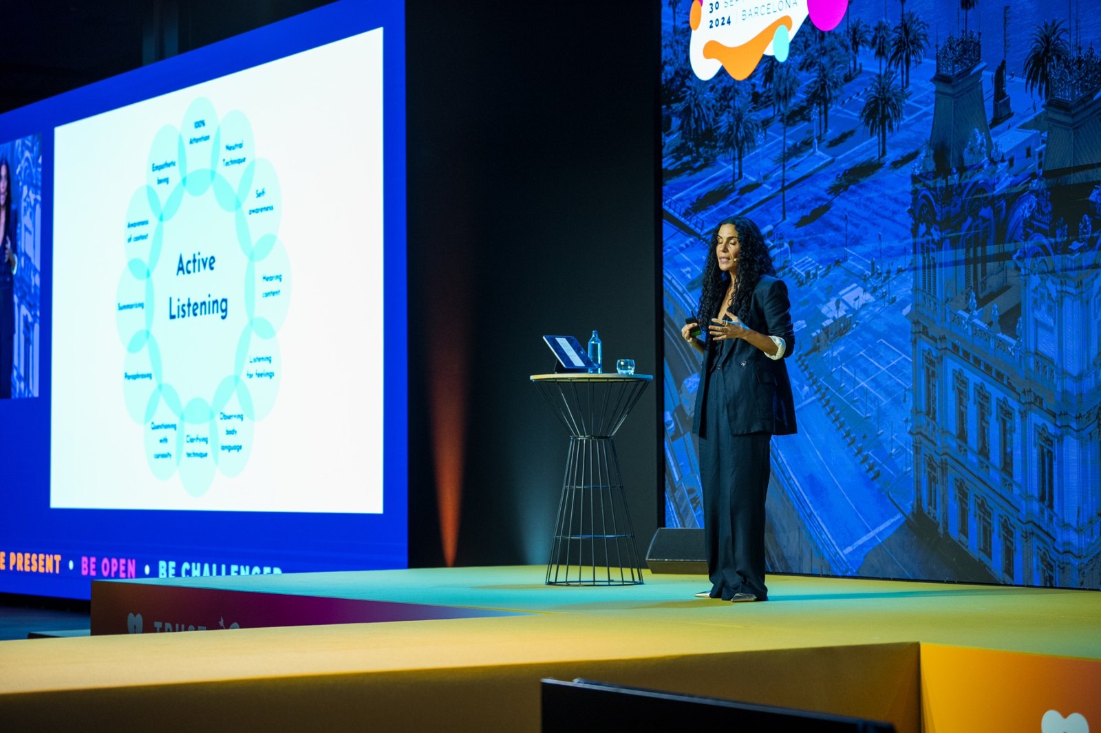 Aline speaking on stage at PCMA